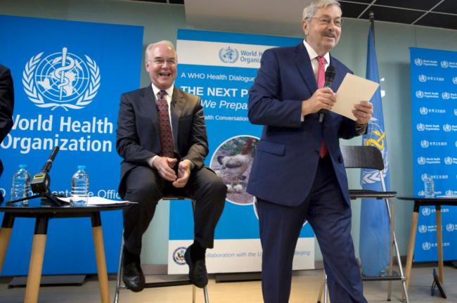 U.S. Health and Human Services Secretary Tom Price, left, reacts near U.S. Ambassador to China Terry Branstad during an event titled "The Next Pandemic" at the World Health Organization office in Beijing Monday, Aug. 21, 2017. [Photo: AP]