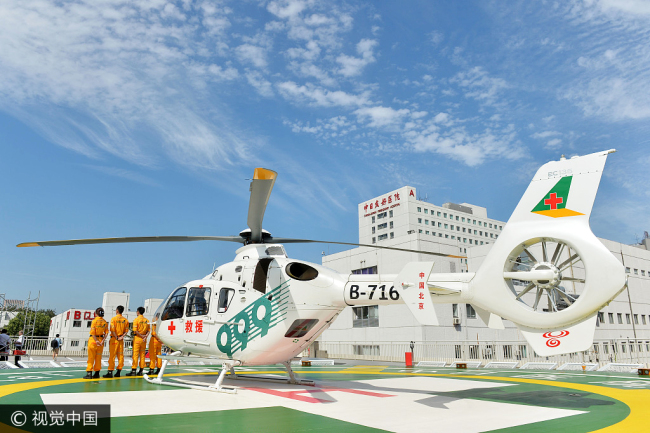 An ambulance helicopter lands on the roof of a new parking structure opened at the China-Japan Friendship Hospital in Beijing on August 29, 2017. [Photo: VCG]