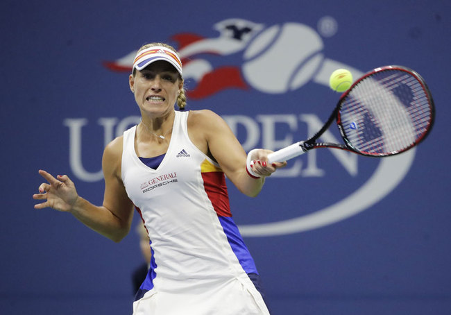 Angelique Kerber, of Germany, returns a shot from Naomi Osaka, of Japan, during the first round of the U.S. Open tennis tournament, Tuesday, Aug. 29, 2017, in New York. [Photo: AP/Frank Franklin II]