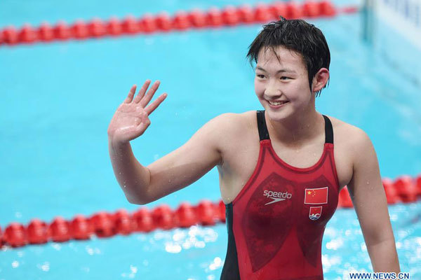 Li Bingjie of Hebei reacts after the women's 400m freestyle swimming final at 13th Chinese National Games in north China's Tianjin Municipality, September 1, 2017. Li Bingjie won the gold medal with 4 minutes and 01.75 seconds. [Photo: Xinhua/Ju Huanzong]