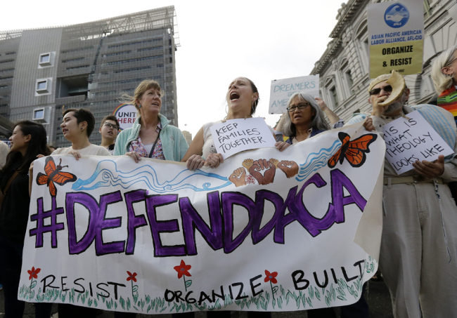 Supporters of the Deferred Action for Childhood Arrivals (DACA) yell during a protest outside of the Federal Building in San Francisco, on Sept. 5, 2017. [Photo: AP/Jeff Chiu]