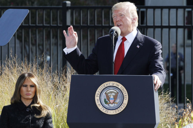 President Donald Trump, right, speaks next to first lady Melania Trump, during the September 11th Pentagon Memorial Observance at the Pentagon on the 16th anniversary of the September 11th attacks, Monday, Sept. 11, 2017. [Photo: AP]