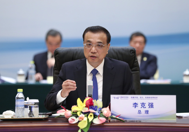 Chinese Premier Li Keqiang holds the '1+6' round table dialogue with heads of major international economic institutions in Beijing on Tuesday, September 12, 2017.[Photo: gov.cn]