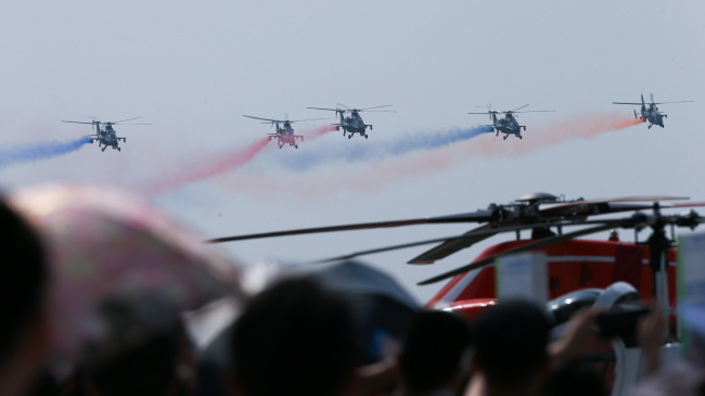 Helicopters fly at the China Helicopter Exposition  in north China's Tianjin Municipality on Thursday, September 14, 2017. [Photo: China Plus/Li Jin]