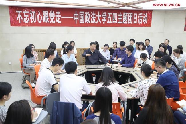 Chinese President Xi Jinping attends a youth league activity with students of Civil, Commercial and Economic Law School while inspecting China University of Political Science and Law in Beijing, capital of China, May 3, 2017.[Photo: Xinhua]