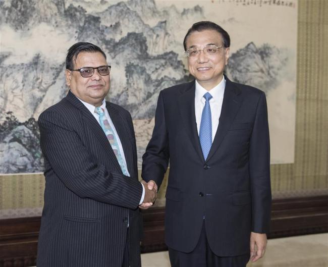Chinese Premier Li Keqiang (R) meets with Nepalese Deputy Prime Minister and Foreign Minister Krishna Bahadur Mahara in Beijing, capital of China, Sept. 7, 2017. [Photo: Xinhua]