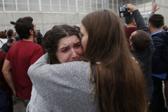A woman cries after civil guards dragged people away from the entrance of a sports center, assigned to be a referendum polling station by the Catalan government in Sant Julia de Ramis, near Girona, Spain, Sunday, Oct. 1, 2017.[Photo: AP]