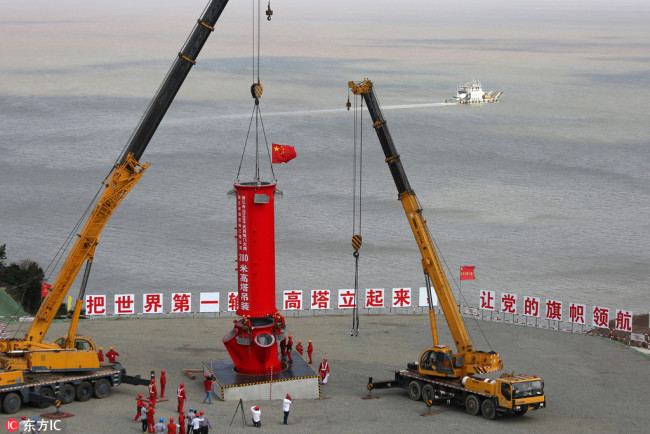 Construction begins on a giant power supply pylon, believed to be the world's tallest, in Zhoushan of east China's Zhejiang Province, on October 1, 2017. [Photo: IC]