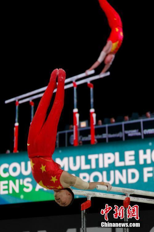 Chinese gymnast Xiao Ruoteng competes in parallel bars competition in men's all-around at the Artistic Gymnastics World Championships in Montreal, Canada on Thursday, October 5, 2017. [Photo: Chinanews.com]