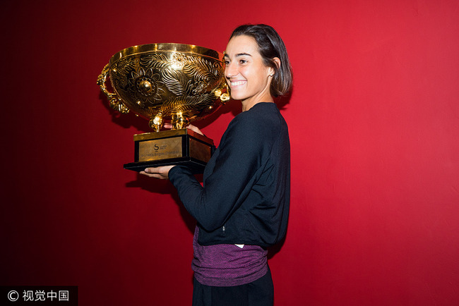 Caroline Garcia of France holds the championship trophy after her win over Simona Halep of Romania at China Open in Beijing, on October 8, 2017. [Photo: VCG]