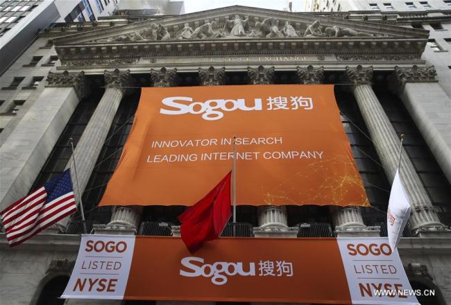 Banners celebrating the initial public offerings (IPO) of Sogou Inc. are seen outside the New York Stock Exchange in New York, the United States, on Nov. 9, 2017. Sogou Inc., a Chinese search engine company backed by Tencent and Sohu, rang the New York Stock Exchange (NYSE) opening bell on Thursday in celebration of its initial public offerings (IPO). Shares of Sogou, trading under the ticker symbol "SOGO", started trading at 13 dollars per ADS on Thursday, and closed at 13.50 dollars apiece, rising 3.85 percent. [Photo: Xinhua/Wang Ying]