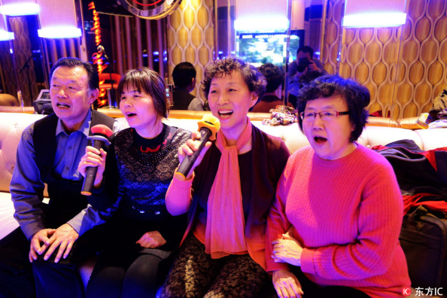 Elderly people sing in a KTV room. [File photo: IC]