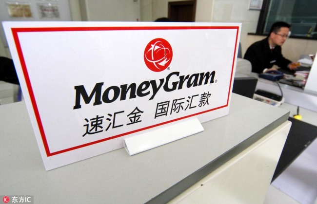 The international money transfer service of MoneyGram counter is seen at a branch of Bank of China in Nantong, Jiangsu Province. [File Photo: IC]