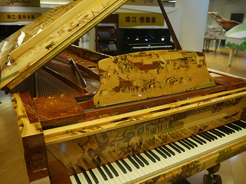 A Chinese-produced piano on display at the Guangzhou Pearl River Piano Group on December 7, 2017 [Photo: China Plus/ Ding Xiaoxiao]