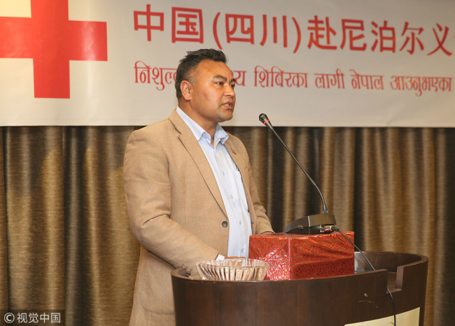 Mayor of Dhulikhel Ashok Byanju Shrestha speaks during the launching ceremony of a week-long free health camp by a team of doctors from China's Sichuan Province, in Kathmandu, capital of Nepal, on December 10, 2017. [Photo: VCG]