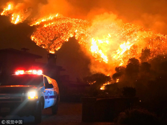Thomas wildfire burns above Bella Vista Drive near Romero Canyon in this social media photo by Santa Barbara County Fire Department in Montecito, California, U.S. December 12, 2017. [Photo: VCG]