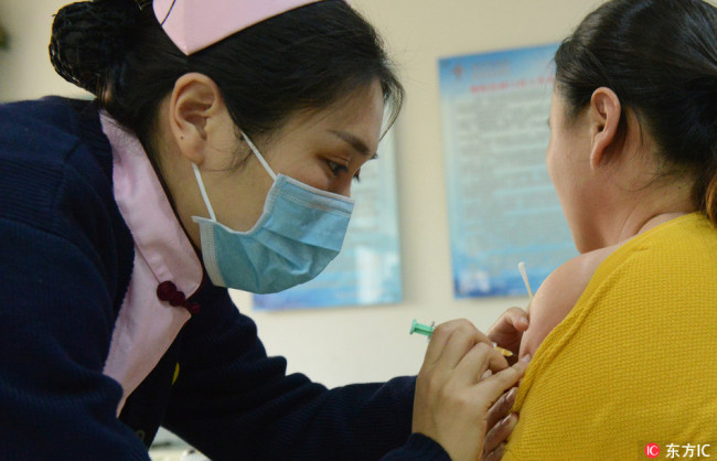 A woman gets vaccination at a hospital in Henan Province on November 14, 2017. [Photo: IC]