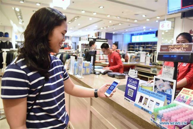 A customer pays with GCash in Manila, the Philippines, Nov. 11, 2017. 