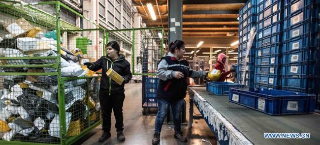Workers sort packages from China at a post center in Santiago, Chile, Aug. 25, 2017. In recent years, a number of China's technological innovations have been making their moves in the world.
