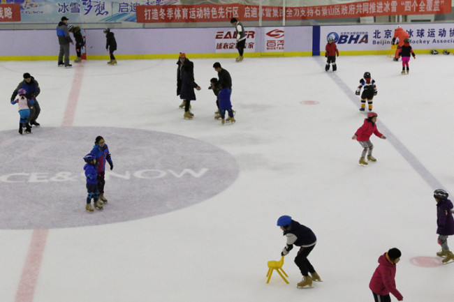 People skate on an ice rink at the Citizen Ice and Snow Sports Center in Beijing, December 24, 2017. [Photo: China Plus/Sang Yarong]