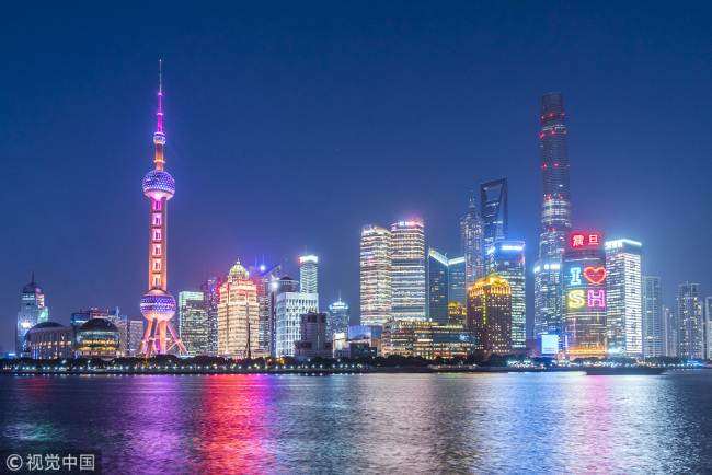 Pudong business district lights up the night in downtown Shanghai, on December 19, 2017. [File photo: VCG]