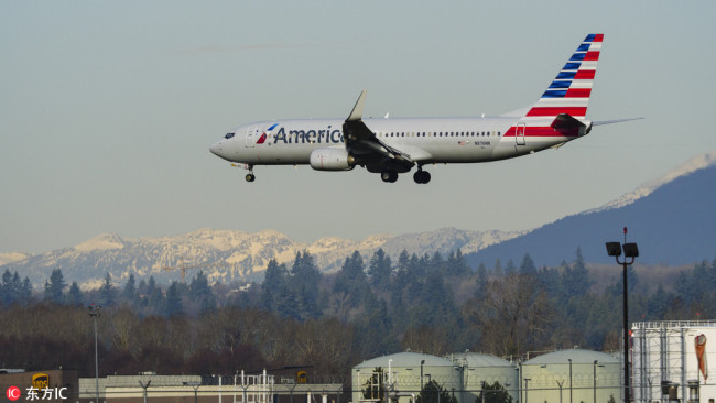 An American Airlines Boeing 737-800 single-aisle narrow-body jet airliner lands at Vancouver International Airport, January 1, 2018. [Photo: www.dfic.cn]