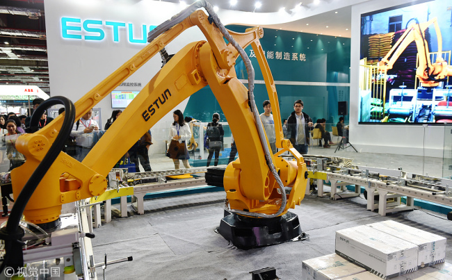 A robot made by Estun Automation is on display at an expo in Shanghai. [File photo: VCG]