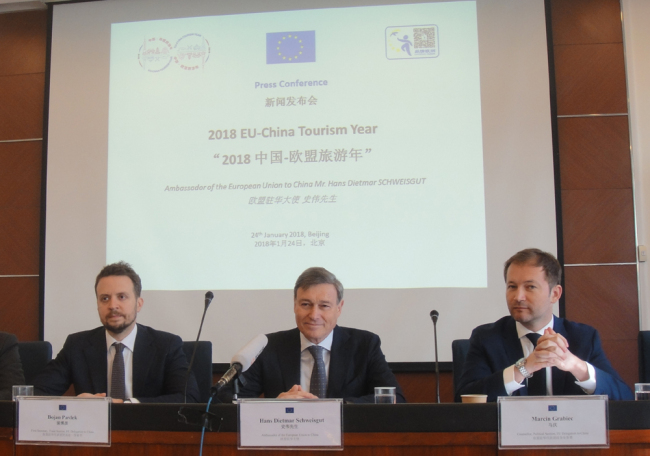 Hans Dietmar Schweisgut(C), the EU Ambassador to China, Bojan Pavlek(L), First Secretary of Trade Section with the EU Delegation to China, and Marcin Grabiec(R), Counsellor of Political Section with the EU Delegation to China, introduce the 2018 China-EU Tourism Year in Beijing on Jan.24, 2018. [Photo: China Plus]