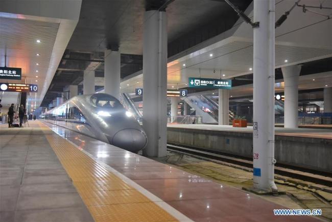 A railway connecting Chongqing and Guiyang pulls out at Guiyang North Railway Station in Guiyang, southwest China's Guizhou Province, Jan. 25, 2018. A railway connecting Chongqing and Guiyang, two major cities in southwest China opened on Thursday. Designed for passenger trains running at a speed of 200 km per hour, the 347-km railway will improve traffic between China's southwest and the rest of the country. [Photo: Xinhua]