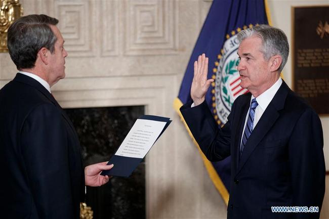 Jerome Powell (R) takes the oath of office as Chairman of the U.S. Federal Reserve, succeeding Janet Yellen, in Washington, the United States. on Feb 5, 2018. [Photo: Xinhua]