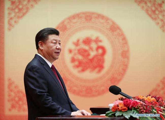Chinese President Xi Jinping, also general secretary of the Communist Party of China (CPC) Central Committee and chairman of the Central Military Commission, delivers a speech to a festival reception at the Great Hall of the People in Beijing, capital of China, Feb. 14, 2018. [Photo: Xinhua]