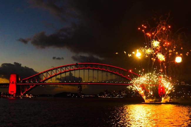 The Sydney Harbour Bridge is lit in auspicious red amid fireworks displays. [Photo courtesy of Sydney City Council]
