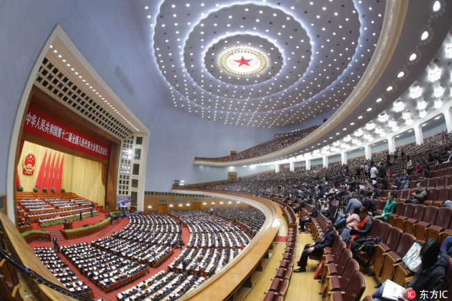 A picture taken with a fish-eye lens shows a general view of the 3rd plenary session of the fifth Session of the 12th National People's Congress (NPC) at the Great Hall of the People in Beijing, China, March 12, 2017.[File Photo: IC]