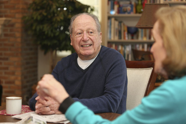 Bill Gurolnick talks with his wife, Peggy Bartelstein, at their home in Northbrook, Illinois, United States, on Feb. 20, 2018. [Photo: AP/Teresa Crawford]