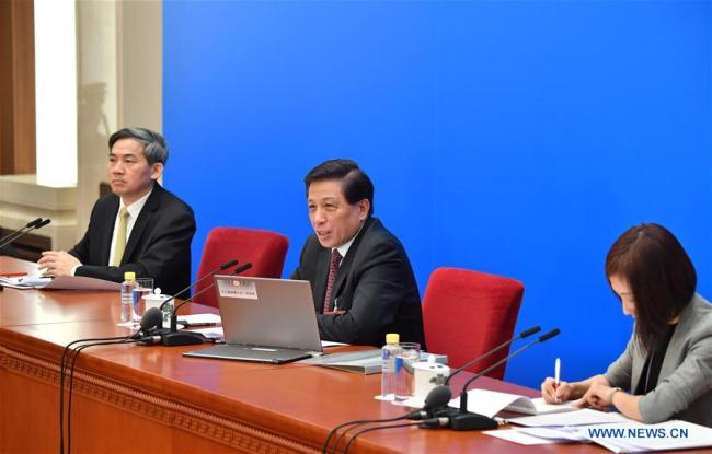 Zhang Yesui (C), spokesperson for the first session of the 13th National People's Congress (NPC), anwsers questions during a press conference on the NPC session at the Great Hall of the People in Beijing, capital of China, March 4, 2018. The first session of the 13th NPC will open in Beijing on March 5.[Photo: Xinhua] 