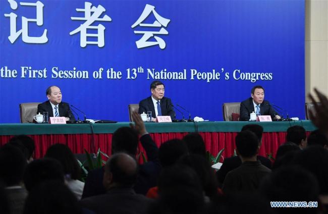 Head of the National Development and Reform Commission (NDRC) He Lifeng (C), deputy heads of the NDRC Zhang Yong (R) and Ning Jizhe take questions during a press conference on innovation and improvement of macro-economic control and promotion of high quality development for the first session of the 13th National People's Congress in Beijing, capital of China, March 6, 2018. [Photo: Xinhua/Wang Jianhua]