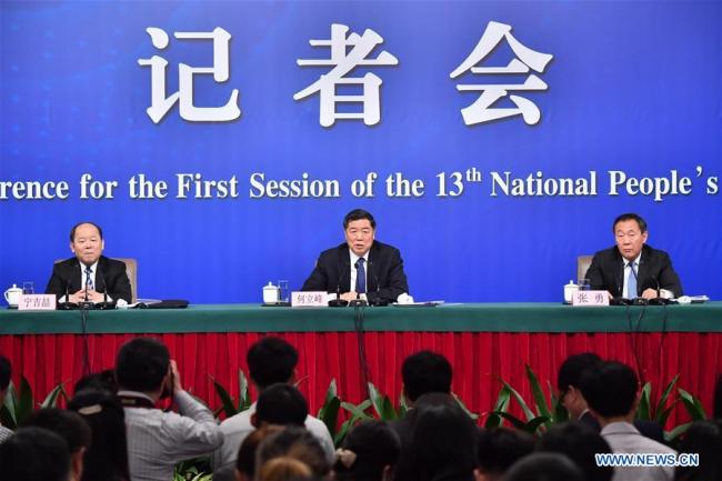 Head of the National Development and Reform Commission (NDRC) He Lifeng (C), deputy heads of the NDRC Zhang Yong (R) and Ning Jizhe, take questions during a press conference on innovation and improvement of macro-economic control and promotion of high quality development for the first session of the 13th National People's Congress in Beijing, capital of China, March 6, 2018. [Photo: Xinhua/Li Xin]