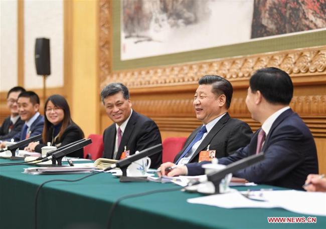 Chinese President Xi Jinping, also general secretary of the Communist Party of China (CPC) Central Committee and chairman of the Central Military Commission, joins a panel discussion with the deputies from Guangdong Province at the first session of the 13th National People's Congress in Beijing, capital of China, March 7, 2018. [Photo: Xinhua/Yan Yan]