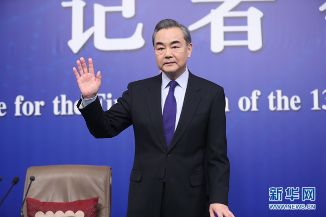 Chinese Foreign Minister Wang Yi meets the press at a news conference in Beijing, on the sidelines of the national legislature's annual session on March 8, 2018. [Photo: Xinhua]