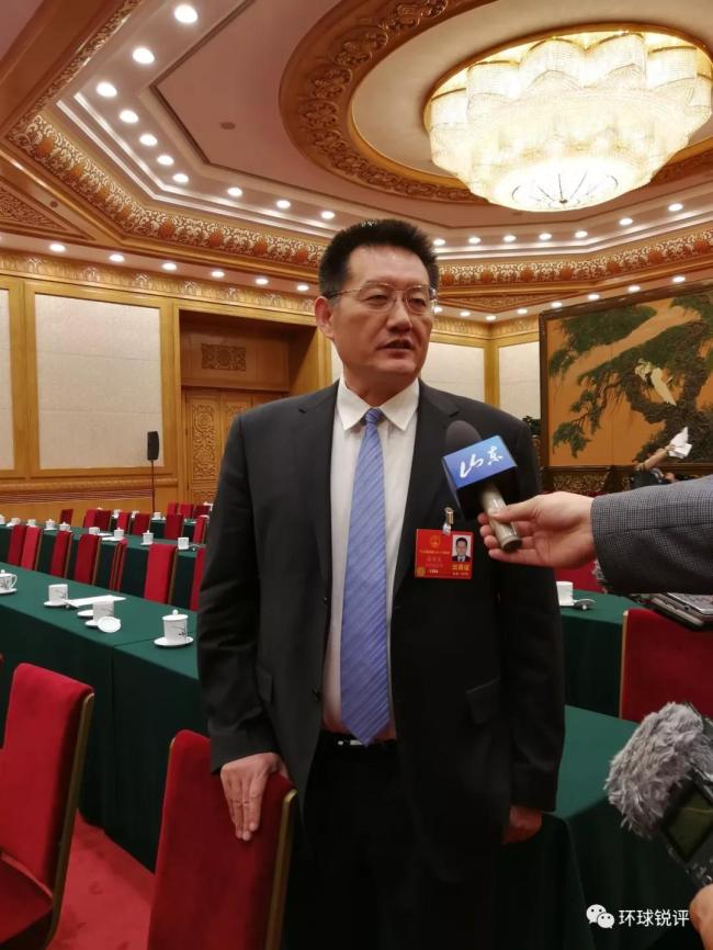 Zhang Xinwen, a deputy from Shandong Province for the 13th National People's Congress (NPC) is interviewed by journalists on March 8, 2018. [Photo: China Plus]