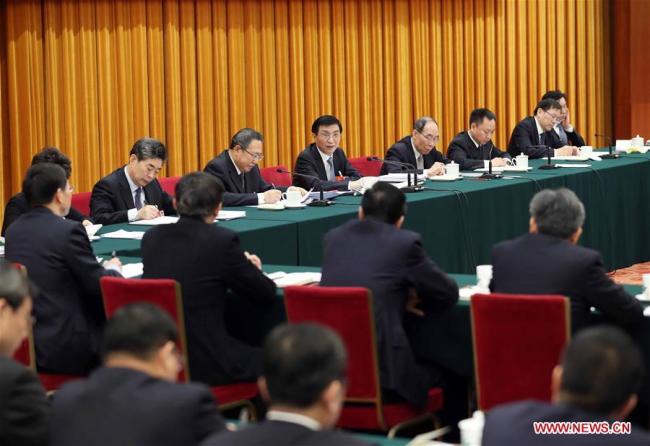 Wang Huning, a member of the Standing Committee of the Political Bureau of the Communist Party of China (CPC) Central Committee, joins a panel discussion with the deputies from Anhui Province at the first session of the 13th National People's Congress in Beijing, capital of China, March 8, 2018. [Photo: Xinhua/Liu Weibing]