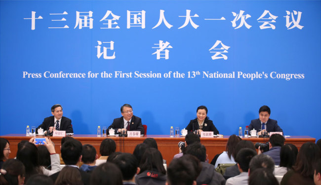 Shen Chunyao (2nd L), secretary of the Bill Group of Secretariat of the first session of the 13th National People's Congress (NPC) and chairman of the Legislative Affairs Commission of the NPC Standing Committee, and Zheng Shuna (2nd R), deputy secretary of the Bill Group of Secretariat of the first session of the 13th NPC and vice chairperson of the Legislative Affairs Commission of the NPC Standing Committee, take questions at a press conference on an amendment to the country's Constitution in Beijing, capital of China, March 11, 2018. [Photo: Xinhua/Jin Liwang]