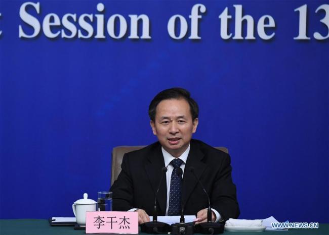 Chinese Minister of Environmental Protection Li Ganjie answers questions at a press conference on the battle against pollution on the sidelines of the first session of the 13th National People's Congress (NPC) in Beijing, capital of China, March 17, 2018. [Photo: Xinhua] 