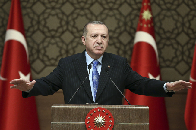 Turkey's President Recep Tayyip Erdogan, gestures as he delivers a speech during a rally in Ankara, Turkey, Wednesday, March 14, 2018. Erdogan expressed hope the Syrian town of Afrin will be encircled by its forces by Wednesday evening, after launching its assault on the Afrin enclave on Jan. 20 to drive out Syrian Kurdish forces. [File Photo: AP/Kayhan Ozer]