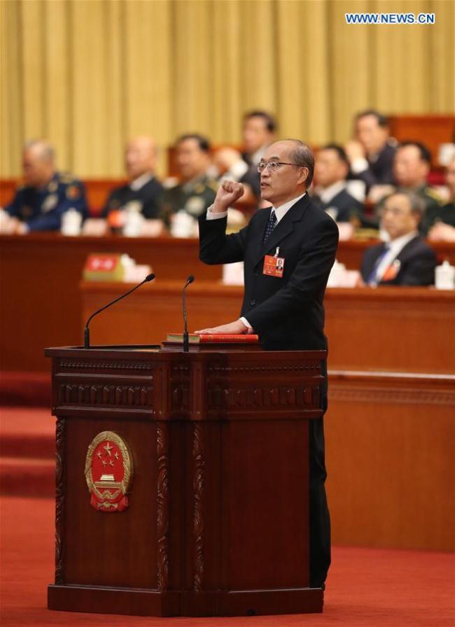 Zhang Jun takes an oath of allegiance to the Constitution in the Great Hall of the People in Beijing, capital of China, March 18, 2018. Zhang Jun was elected procurator-general of the Supreme People's Procuratorate Sunday at the first session of the 13th National People's Congress, China's national legislature. [Photo: Xinhua/Yao Dawei]