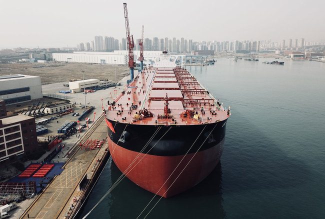 A 400,000-ton ore carrier, Ore Tianjin, was delivered to Brazil's iron ore giant Vale in the coastal city of Qingdao in east China's Shandong Province on March 22, 2018. The domestically-built ship can carry more than 6,600 railway cars of ore. [Photo: China Plus/Li Jin]