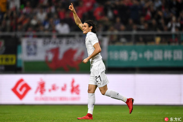 Edinson Cavani of Uruguay celebrates scoring during the final match between Wales and Uruguay at the 2018 China Cup International Football Championship in Nanning, capital of south China's Guangxi Zhuang Autonomous Region, March 26, 2018. [Photo: Imagine China]