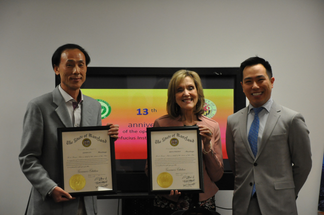 Donna Wiseman(center) and Jianxin Cui(left), director and deputy director of Confucius Institute at The University of Maryland, accepted citations from Shawn Eum(right), policy advisor of Maryland Governor's office, at the Institute's 13th anniversary celebration. Yian Ke/China Daily