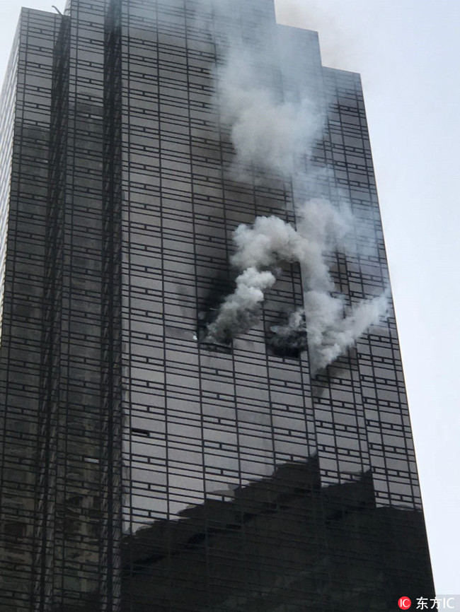 Smoke rises from the 50th floor of Trump Tower in New York, United States on April 7, 2018. [Photo: IC]