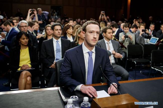 Facebook CEO Mark Zuckerberg (C) testifies at a joint hearing of the Senate Judiciary and Commerce committees on Capitol Hill in Washington D.C., United States, on April 10, 2018. Facebook CEO Mark Zuckerberg told Congress in written testimony on Monday that he is "responsible for" not preventing the social media platform from being used for harm, including fake news, foreign interference in elections and hate speech. [Photo: Xinhua/Ting Shen]